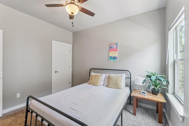 637 NW 179th Cir, Edmond, OK 73012 - bedroom with carpet flooring, multiple windows, and ceiling fan