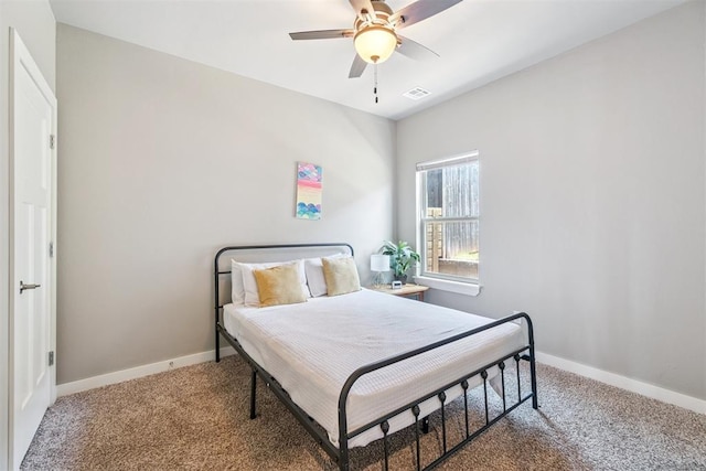 637 NW 179th Cir, Edmond, OK 73012 - bedroom with carpet flooring and a ceiling fan