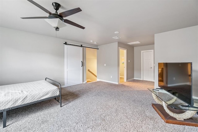 637 NW 179th Cir, Edmond, OK 73012 - bedroom featuring a barn door, carpet floors, and a ceiling fan