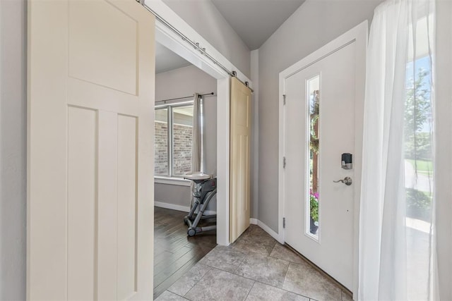 637 NW 179th Cir, Edmond, OK 73012 - entrance foyer featuring healthy amount of natural light and a barn door
