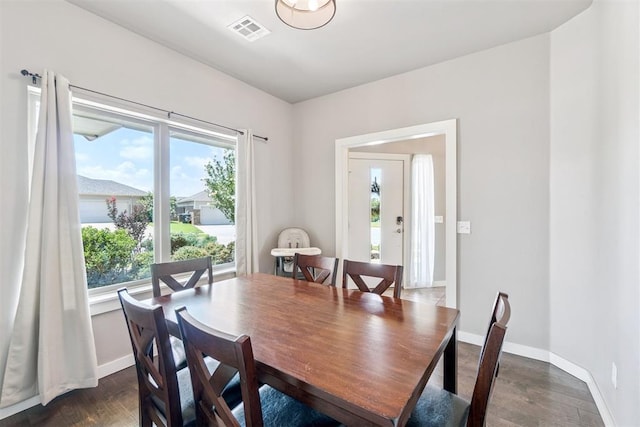 637 NW 179th Cir, Edmond, OK 73012 - dining area featuring dark wood-style floors and baseboards