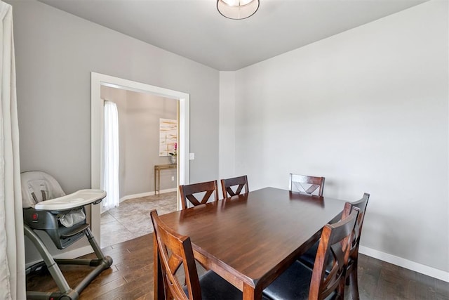 637 NW 179th Cir, Edmond, OK 73012 - dining area with dark wood-style flooring and baseboards