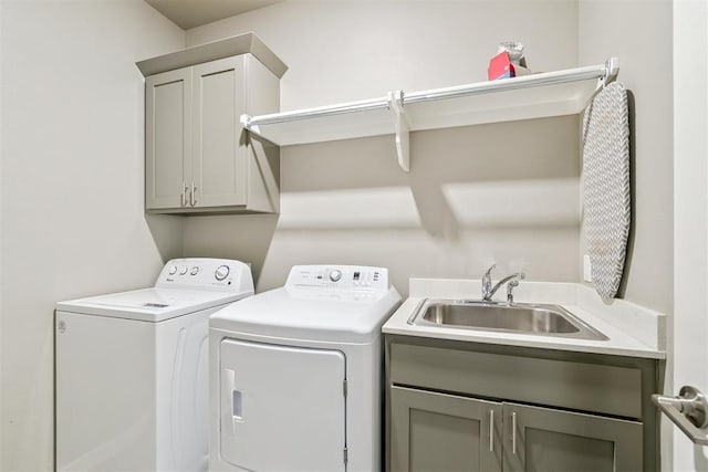 637 NW 179th Cir, Edmond, OK 73012 - laundry area with washer and clothes dryer and cabinet space