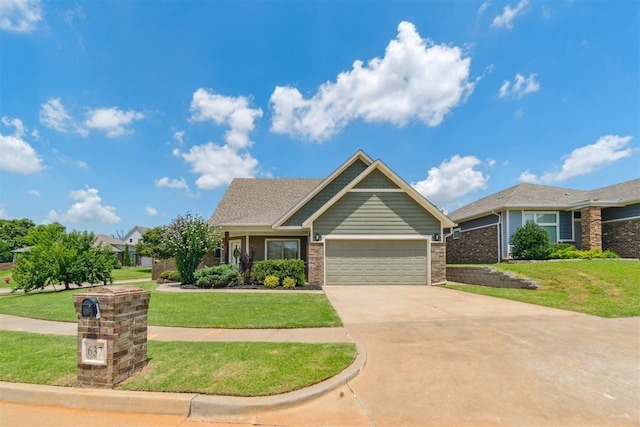 637 NW 179th Cir, Edmond, OK 73012 - view of front of home with a front yard, an attached garage, and concrete driveway