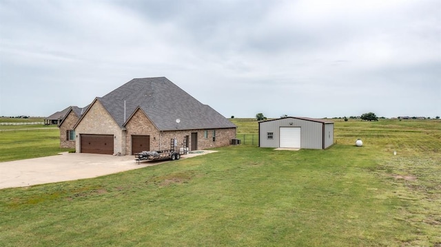 9125 NE Mustang Rd, Piedmont, OK 73078 - view of property exterior featuring a yard, driveway, brick siding, an outbuilding, and an attached garage