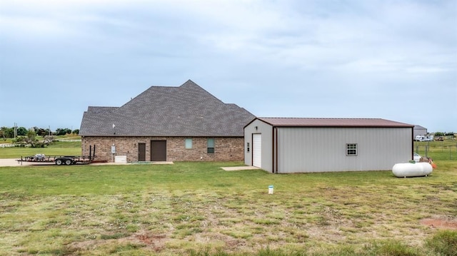 9125 NE Mustang Rd, Piedmont, OK 73078 - rear view of house with a yard and an outbuilding