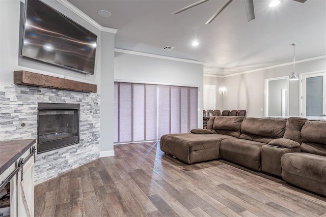 9125 NE Mustang Rd, Piedmont, OK 73078 - living room with ceiling fan, crown molding, dark wood finished floors, a fireplace, and recessed lighting