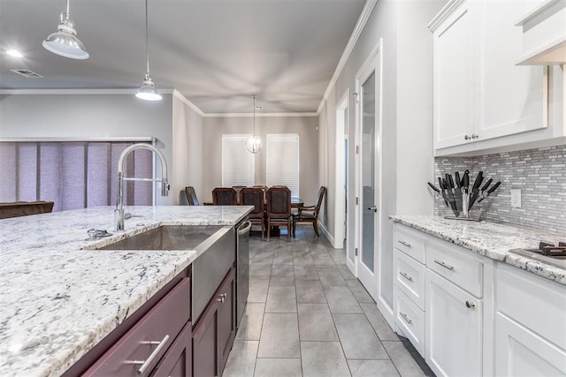 9125 NE Mustang Rd, Piedmont, OK 73078 - kitchen featuring backsplash, stainless steel dishwasher, white cabinets, decorative light fixtures, and ornamental molding