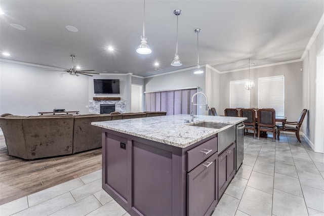 9125 NE Mustang Rd, Piedmont, OK 73078 - kitchen with ceiling fan, a stone fireplace, crown molding, a center island with sink, and light tile patterned flooring