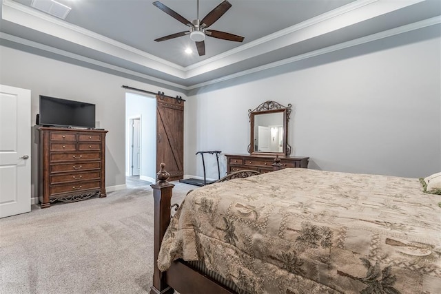 9125 NE Mustang Rd, Piedmont, OK 73078 - bedroom with carpet flooring, crown molding, a barn door, ceiling fan, and a raised ceiling