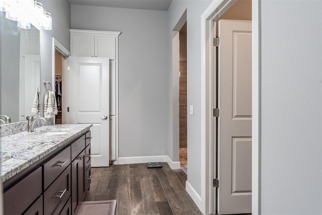 9125 NE Mustang Rd, Piedmont, OK 73078 - bathroom with wood finished floors, vanity, and a chandelier