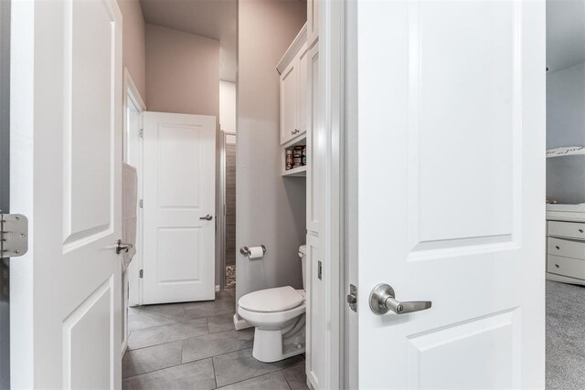 9125 NE Mustang Rd, Piedmont, OK 73078 - bathroom featuring toilet and tile patterned floors
