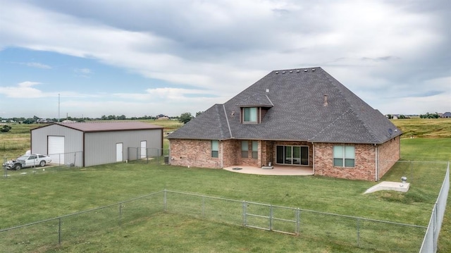 9125 NE Mustang Rd, Piedmont, OK 73078 - back of house with a fenced backyard, a detached garage, brick siding, a patio area, and roof with shingles