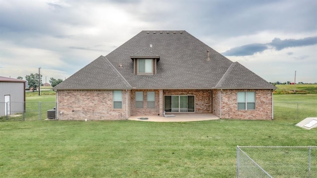 9125 NE Mustang Rd, Piedmont, OK 73078 - rear view of house with a fenced backyard, a patio, brick siding, and a shingled roof