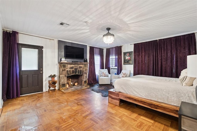 2625 Somerset Pl, Oklahoma City, OK 73116 - bedroom with a stone fireplace and a chandelier