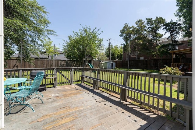 2625 Somerset Pl, Oklahoma City, OK 73116 - wooden deck featuring a storage shed, a fenced backyard, and a grill