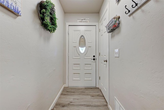 201 N English Dr, Moore, OK 73160 - entryway featuring light wood finished floors and baseboards