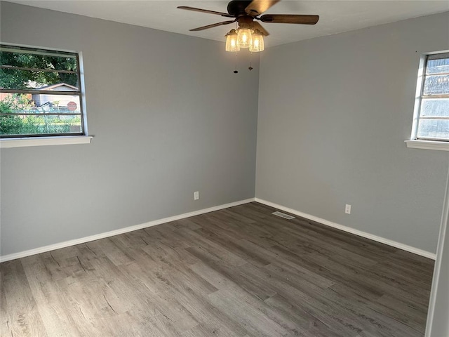 1501 W Watts St, El Reno, OK 73036 - empty room with dark wood-style flooring and ceiling fan