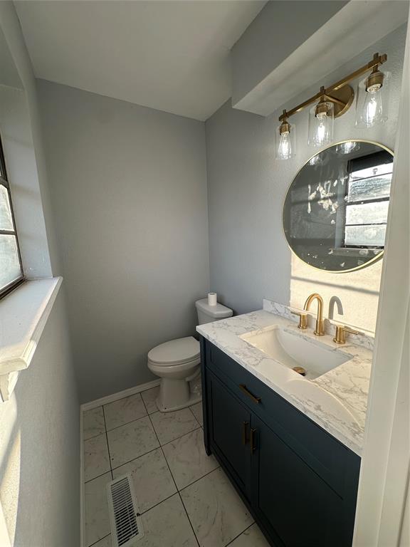 1501 W Watts St, El Reno, OK 73036 - bathroom with vanity and marble finish flooring