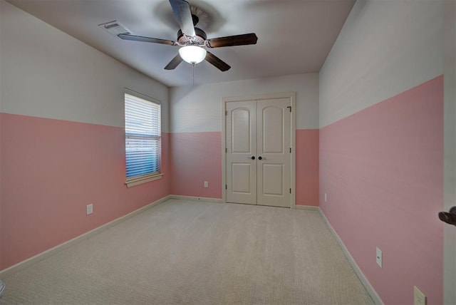 9920 NW 142nd St, Yukon, OK 73099 - unfurnished bedroom featuring light colored carpet, a closet, and a ceiling fan