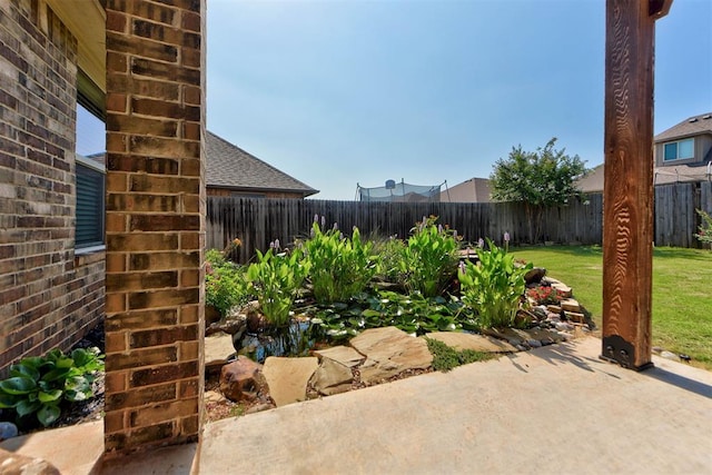 9920 NW 142nd St, Yukon, OK 73099 - fenced backyard featuring a patio area