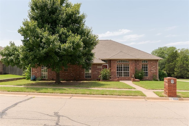 1723 Grey Hawk Rd, Edmond, OK 73003 - view of front of home featuring a front yard and brick siding