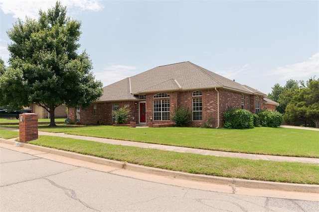 1723 Grey Hawk Rd, Edmond, OK 73003 - ranch-style house featuring brick siding and a front lawn