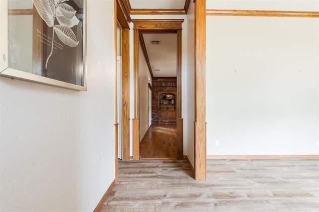 1723 Grey Hawk Rd, Edmond, OK 73003 - hall featuring wood finished floors and ornamental molding