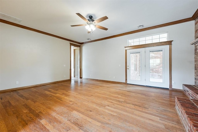 1723 Grey Hawk Rd, Edmond, OK 73003 - empty room featuring a ceiling fan, ornamental molding, light wood-type flooring, and a brick fireplace
