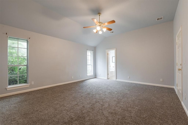 1723 Grey Hawk Rd, Edmond, OK 73003 - empty room featuring a ceiling fan, vaulted ceiling, and carpet floors