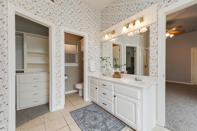 1723 Grey Hawk Rd, Edmond, OK 73003 - full bathroom with wallpapered walls, vanity, a ceiling fan, and tile patterned floors