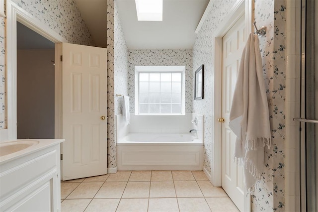 1723 Grey Hawk Rd, Edmond, OK 73003 - full bath featuring wallpapered walls, a bath, tile patterned floors, vanity, and lofted ceiling