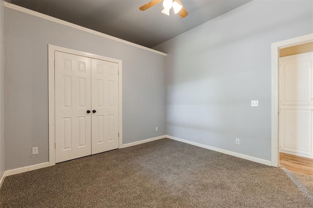 1723 Grey Hawk Rd, Edmond, OK 73003 - unfurnished bedroom featuring carpet, a closet, and ceiling fan