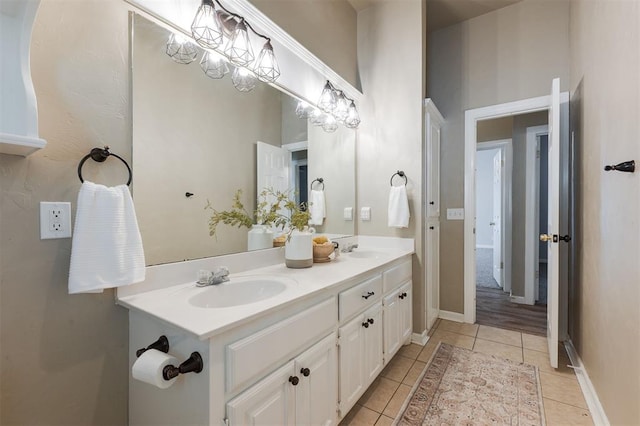 1723 Grey Hawk Rd, Edmond, OK 73003 - full bath featuring double vanity and tile patterned flooring