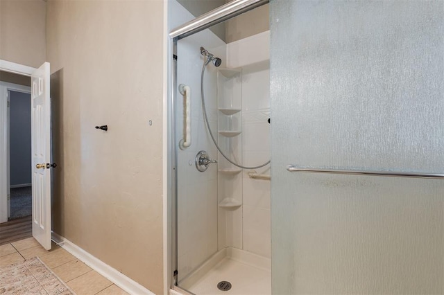 1723 Grey Hawk Rd, Edmond, OK 73003 - bathroom featuring a stall shower and tile patterned flooring