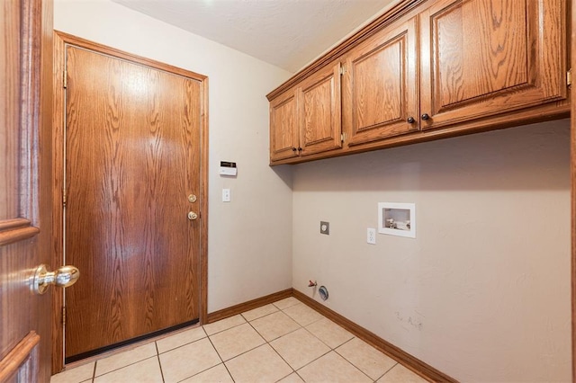1723 Grey Hawk Rd, Edmond, OK 73003 - washroom featuring cabinet space, hookup for a washing machine, electric dryer hookup, and light tile patterned floors