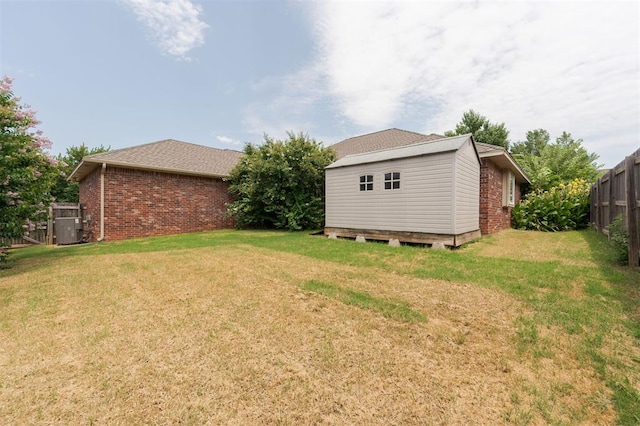 1723 Grey Hawk Rd, Edmond, OK 73003 - view of yard with an outbuilding