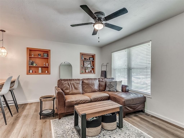 2244 Downing St, Oklahoma City, OK 73120 - living room with a ceiling fan, light wood-type flooring, and built in features