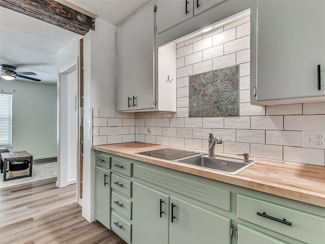2244 Downing St, Oklahoma City, OK 73120 - kitchen with wooden counters, green cabinetry, ceiling fan, decorative backsplash, and light wood-style floors