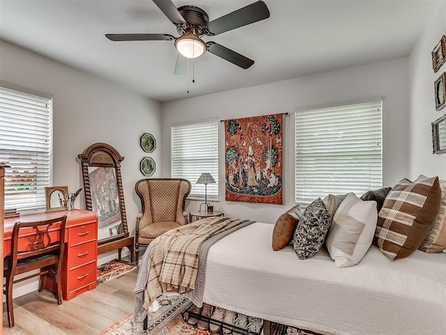 2244 Downing St, Oklahoma City, OK 73120 - bedroom with light wood-style flooring and a ceiling fan