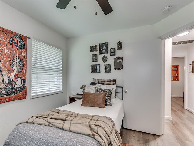 2244 Downing St, Oklahoma City, OK 73120 - bedroom featuring wood finished floors and a ceiling fan