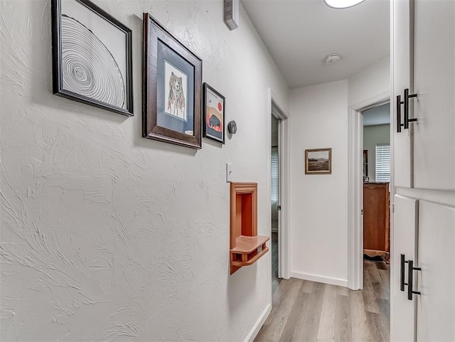 2244 Downing St, Oklahoma City, OK 73120 - hallway with wood finished floors and baseboards