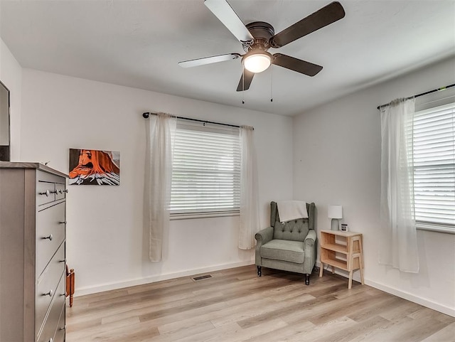 2244 Downing St, Oklahoma City, OK 73120 - sitting room with light wood-style floors and ceiling fan