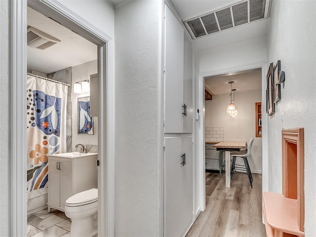2244 Downing St, Oklahoma City, OK 73120 - full bathroom featuring vanity and shower / bath combination with curtain