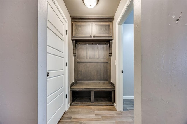 2208 Rivera Rd, Yukon, OK 73099 - mudroom featuring light wood finished floors and a textured wall