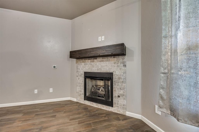 2208 Rivera Rd, Yukon, OK 73099 - detailed view of wood finished floors and a brick fireplace