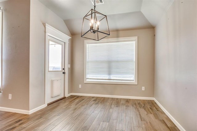 2208 Rivera Rd, Yukon, OK 73099 - foyer with a chandelier, plenty of natural light, light wood finished floors, and vaulted ceiling