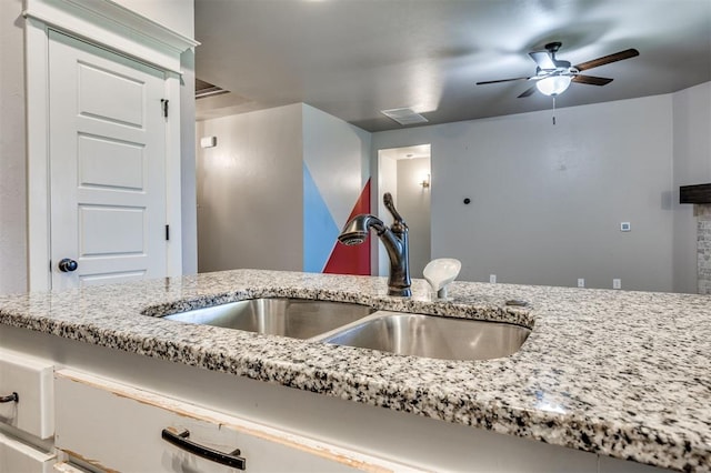 2208 Rivera Rd, Yukon, OK 73099 - detailed view of a sink and a ceiling fan