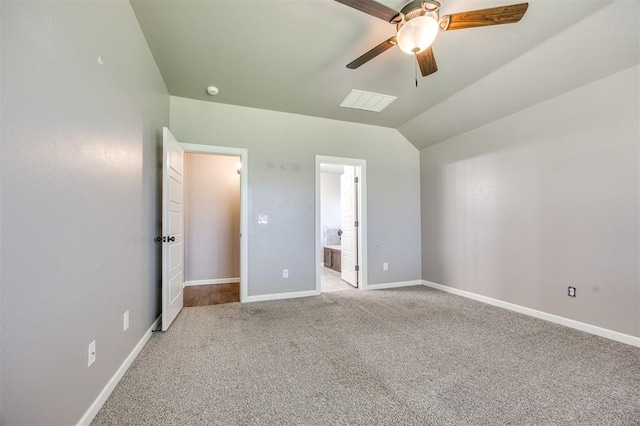 2208 Rivera Rd, Yukon, OK 73099 - unfurnished bedroom with carpet, lofted ceiling, connected bathroom, and ceiling fan