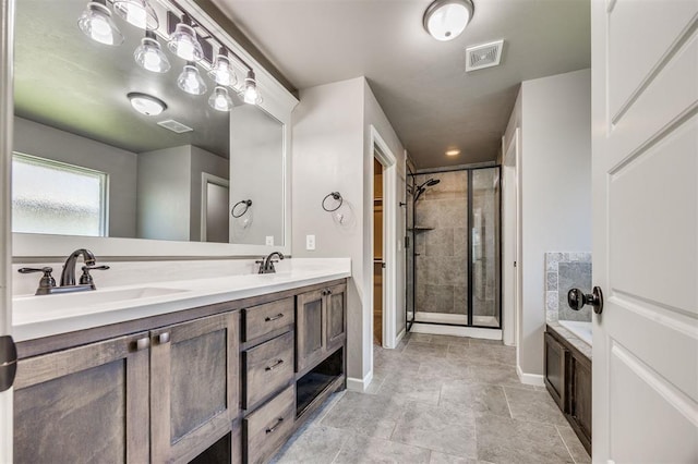 2208 Rivera Rd, Yukon, OK 73099 - bathroom featuring a shower stall, double vanity, and a bath